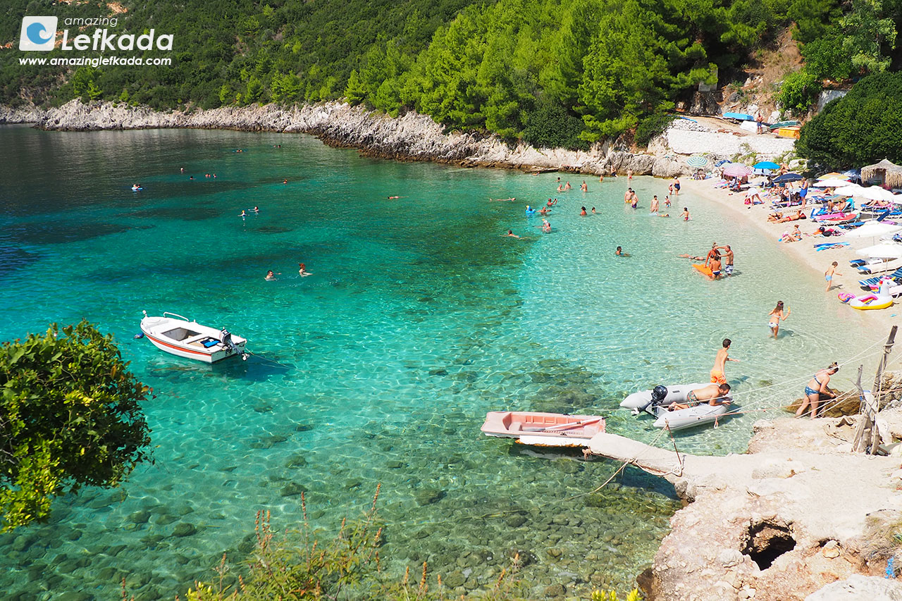 View to Paralia Afteli beach with swimmers, snorkeling and sunbeds