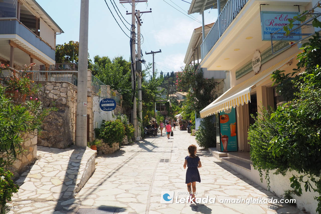 Central street pof Agios Nikitas with restaurants and supermarkets, tourist offices Central street pof Agios Nikitas with restaurants and supermarkets, tourist offices
