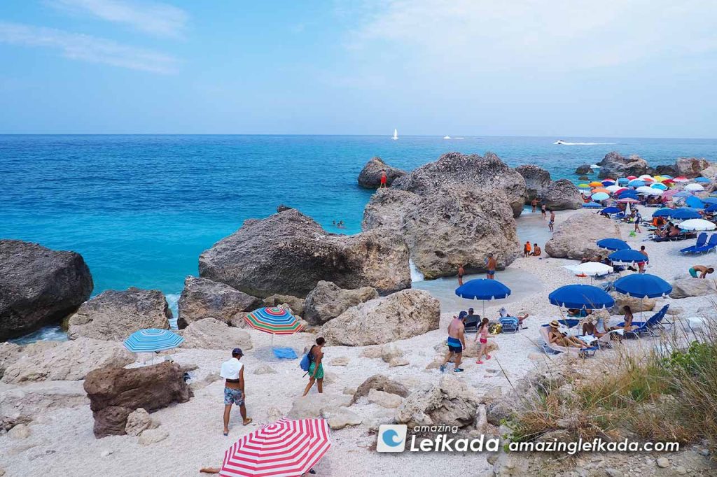 Coast of Paralia Kavalikefta beach with rocks and sunbeds