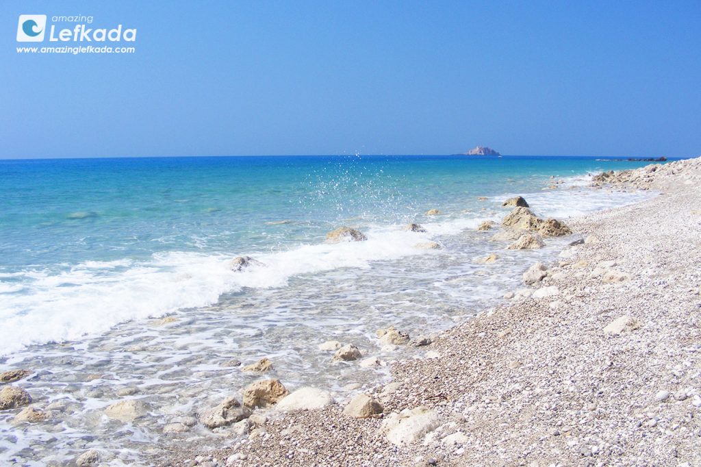 Gialos beach waves, pebbles and coarse sand