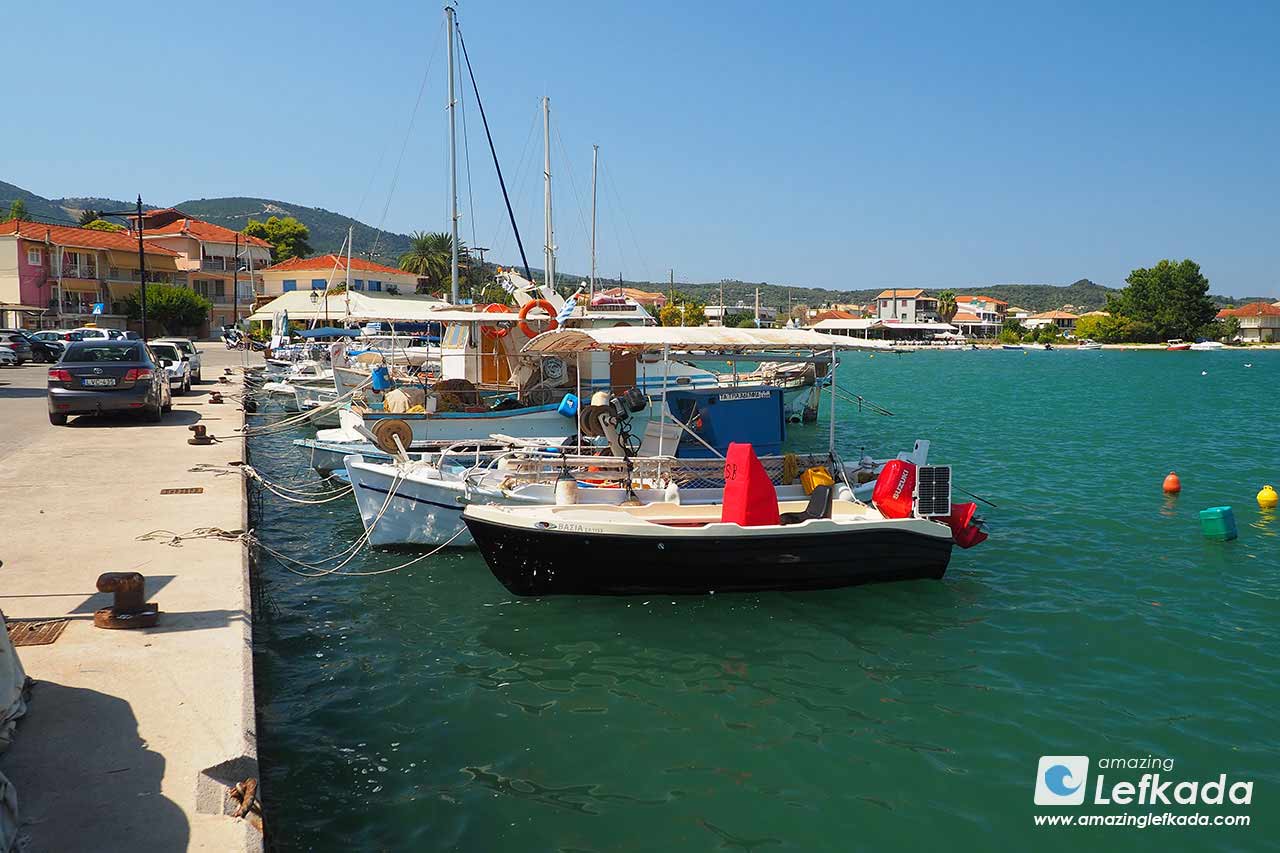 Port of Ligia with boats, parking and restaurants
