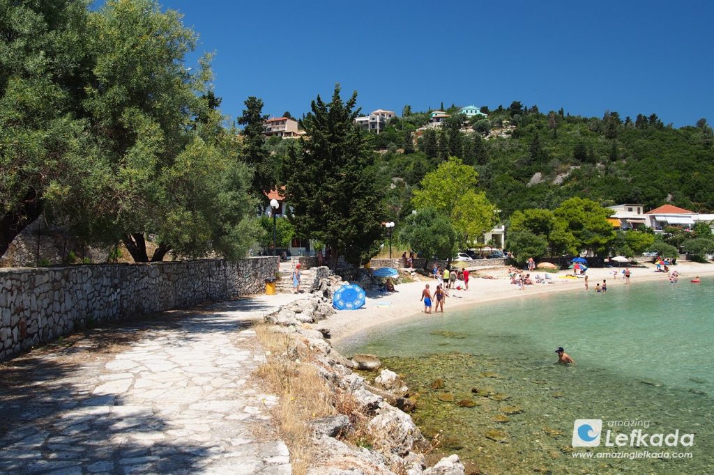 View to Paralia Nikiana beach and children swimming in the sea in Lefkada Island