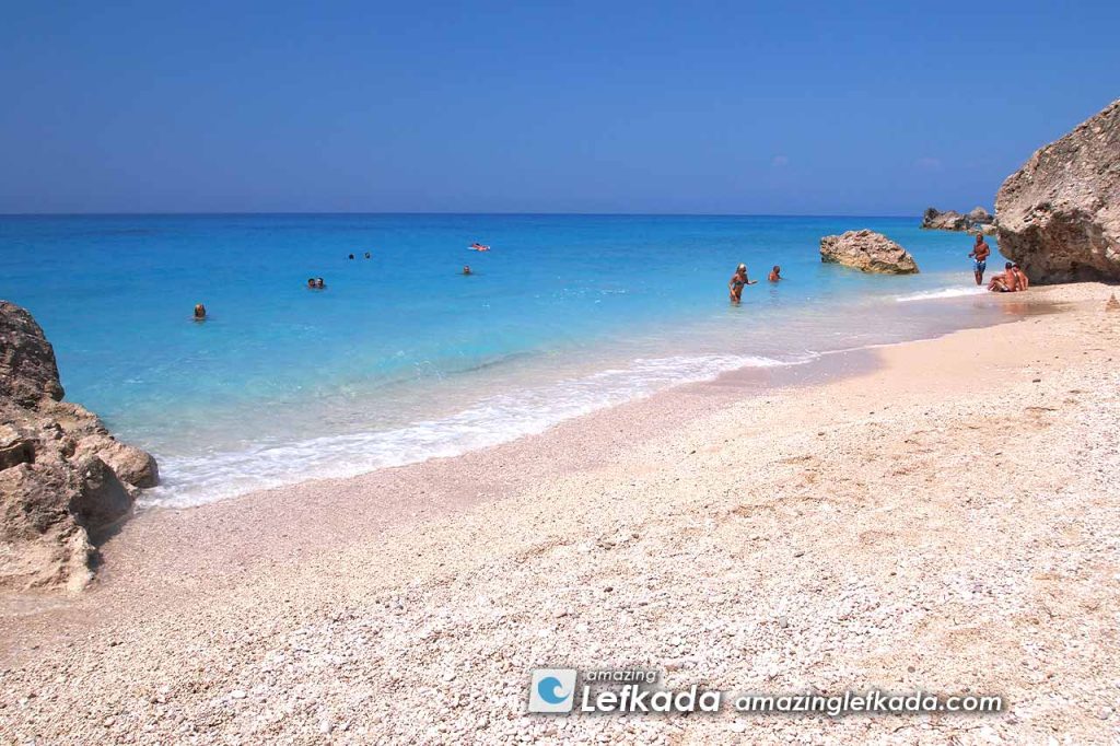 White coarse sand and blue sea in Lefkada Island Megali Petra beach