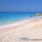White coarse sand and blue sea in Lefkada Island Megali Petra beach