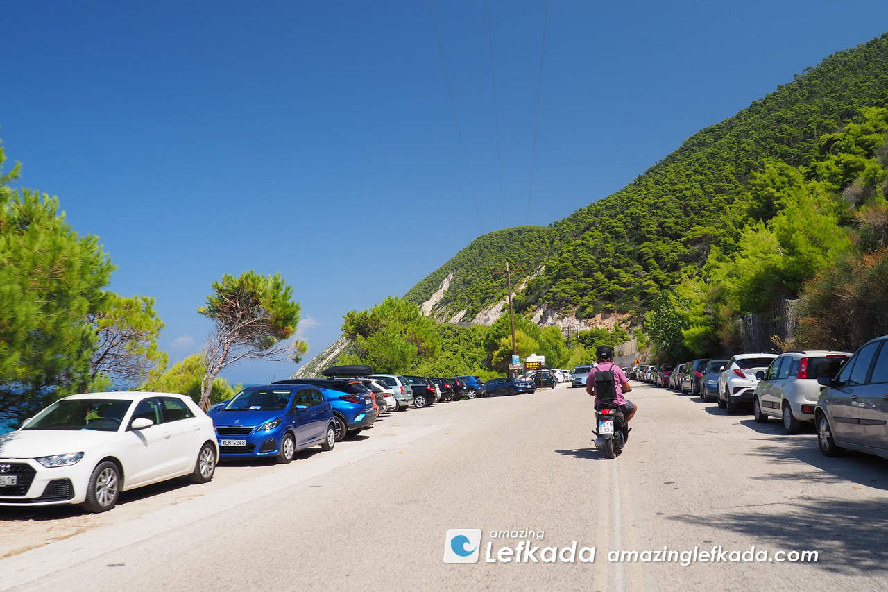 Free parking lot at Pefkoulia beach for cars and motorbikes Parking lot of Pefkoulia beach with cars and motorbikes