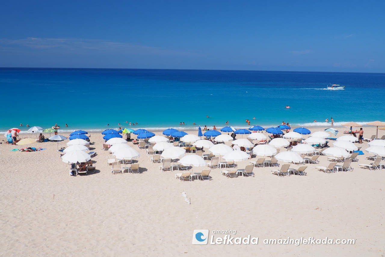 Line of parasols and sunbeds on the beach