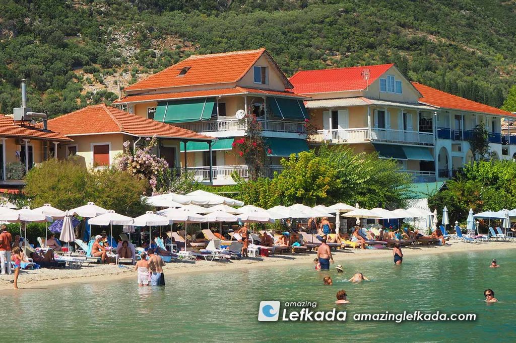 Sunbeds, restaurants and bars behind Paralia Nydri beach