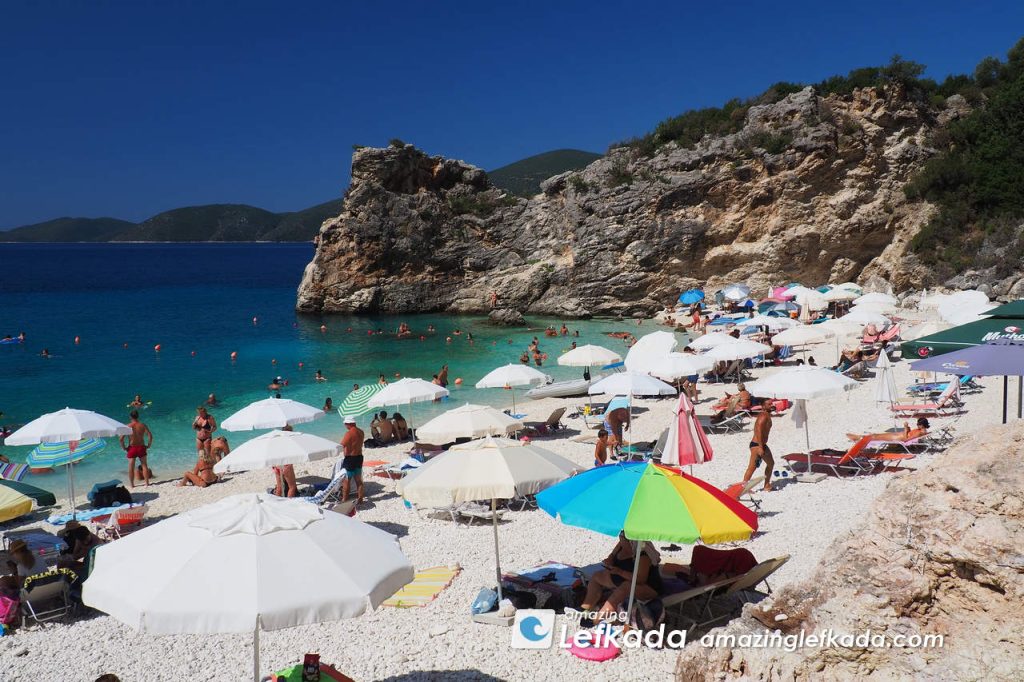 View to sunbeds of Agiofili beach in Lefkada Island, Greece where the  sea is calm and blue