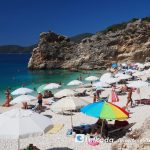 View to sunbeds of Agiofili beach in Lefkada Island, Greece where the sea is calm and blue